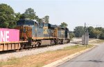 CSX 4043 leads 5301 and a line of containers